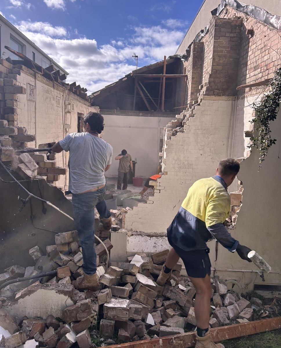 Manual demolition of rear masonry at Bar Beach